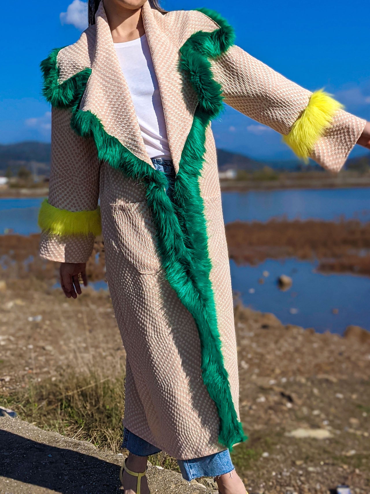 Front view of handmade pink kimono jacket with green faux-fur collar trim and neon yellow faux-fur cuffs.